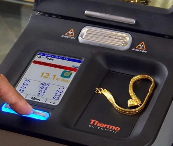 XRF analyser used for gold testing services, with jewellery in its chamber
